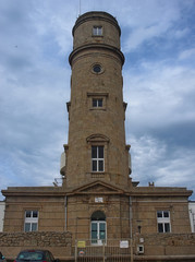 Fototapeta na wymiar Big stone lighthouse near Cherbourg, France