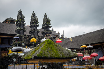 View of the stone pillars and straw pagodas for religious ceremonies inside Pura Besakih or Mother...
