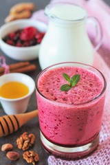 Berry fruits smoothie with vegan milk and honey, summer dessert for well being and healthy lifestyle