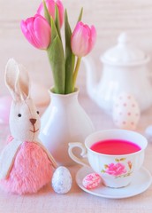 beautiful easter table decoration with  eggs ,rabbits and flowers in pastel colors
