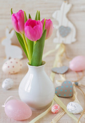 beautiful easter table decoration with  eggs ,rabbits and flowers in pastel colors