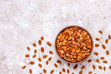Beech nuts on light background,top view