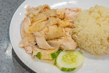 Delicious Singaporean Hainan chicken rice on white plate