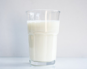 Glass of milk in drinking concept.