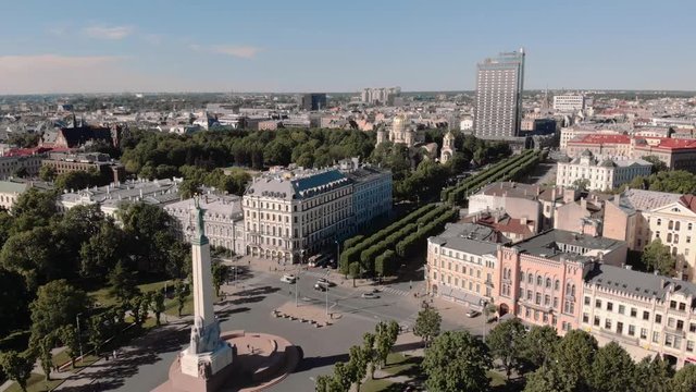 Aerial shot from Sunny summer day in City center of Latvia's capital Riga with and statue of freedom - Milda