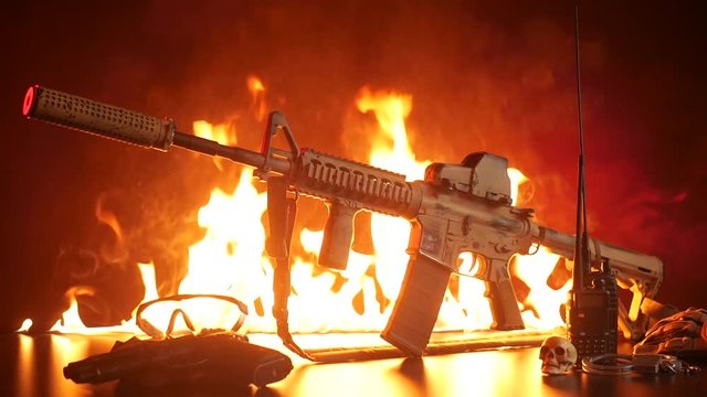 American automatic rifle in smoke and fire