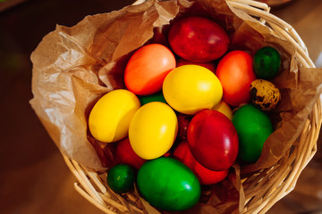 Fototapeta na wymiar Easter eggs in a basket at brunch