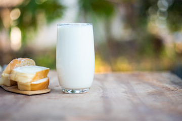 Milk and breads on blur background.