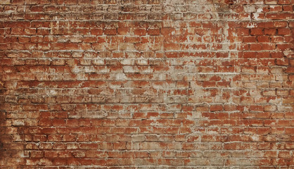 old red brick wall with a thick layer of paint