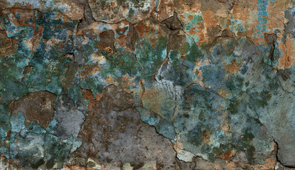fantastic multi color painted stucco wall with cracks and peeling paint flakes
