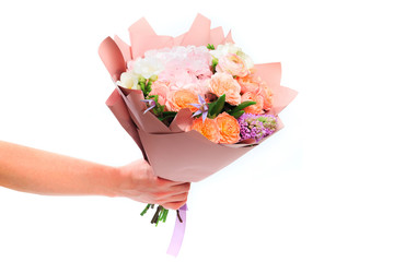 Mans hand holding Bouquet of mixed spring flowers  isolated on white background  - Image