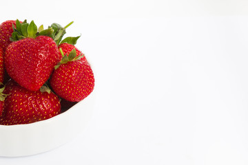 bowl with strawberries isolated on white background