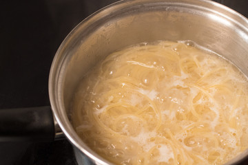 pasta is cooked in a pot