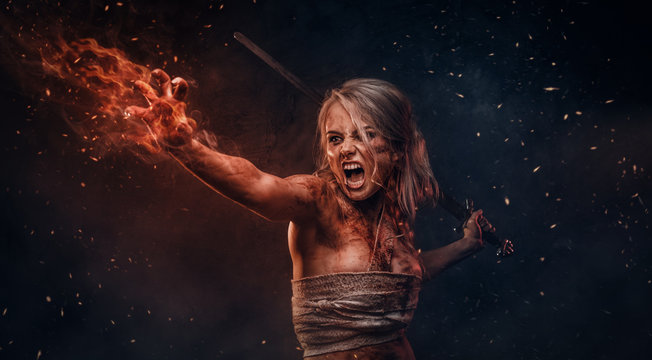 Fantasy woman warrior wearing rag cloth stained with blood and mud in the heat of battle. Cosplayer as Ciri from The Witcher