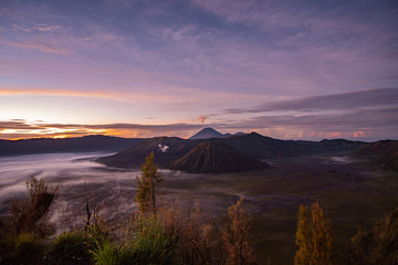 Mount Bromo in Java Indonesia during sunrise early in the morning with beautiful colours and fog
