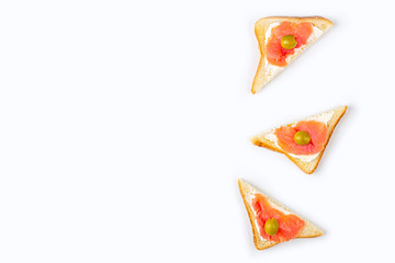 Appetizer, open sandwich with salmon and soft cheese on white background. Traditional Italian or Scandinavian cuisine. Concept of proper nutrition and healthy eating. Flat lay, copy space for text
