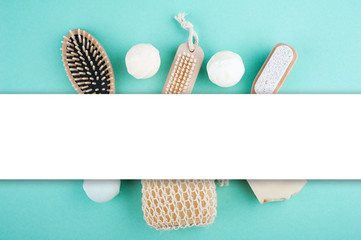 Wooden natural spa objects on mint green background