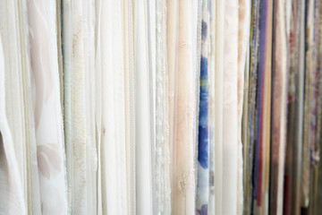 Obraz premium Display stand with the sale of different curtains in the store. Close-up