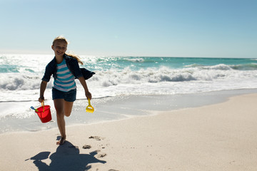 Girl playing at the beach