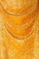 Thai gold pattern on the fabric statue.