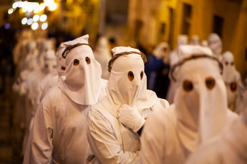 Christian brethren during the traditional Good Friday procession, Leonforte