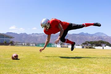 Naklejka premium Football player playing football