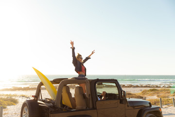 Couple in a car at the beach