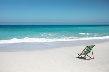 Chair in front of the waves
