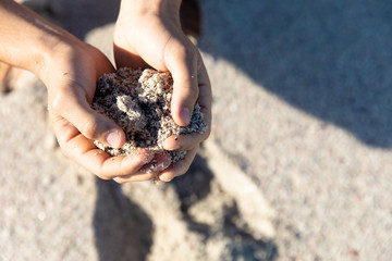 Sand on hands