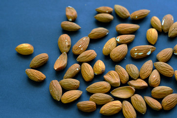 walnut almonds. isolate on blue  the background