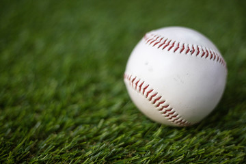Baseball on green background