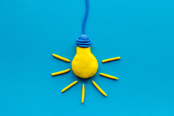 Invention concept. Bulb icon on blue background top-down copy space