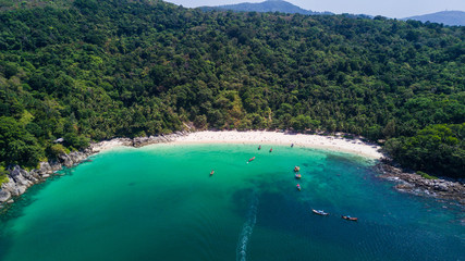 Aerial shooting of Freedom beach, Phuket, Thailand. Beautiful tropical island with white sand beach and turquoise clear water