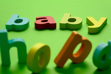Word BABY HOPE on green background.Learning the English alphabet and language.The concept of child education, school, kindergarten