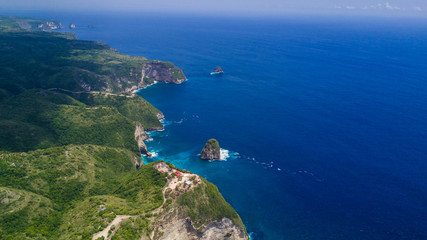 Aerial view of the tropical coast of the island of Nusa Penida, beach of Kelingking, Indonesia