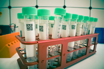 Closed test tube with barcode QR biological sample. Toned Image. Test tubes with QR code