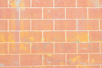Fototapeta na wymiar Background, wall of large orange stones