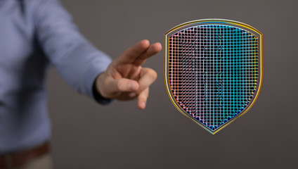 shield protection concept holding in hand