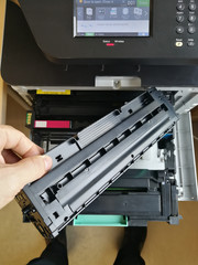 Male changing copy machine cartridge