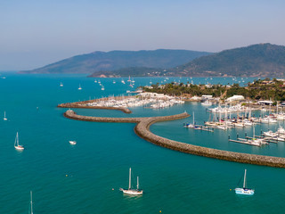 Panoramic marina town aerial. Airlie beach waterfront aerial view. Dramatic DRONE view from above....
