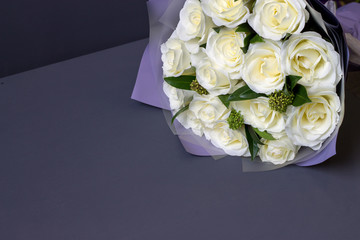 bouquet of white roses on a gray background copy space