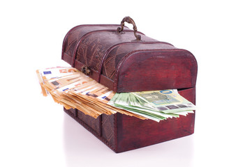 Euro banknotes in the old retro chest isolated