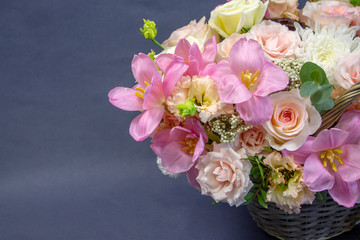 composition of fresh flowers close-up on a gray background