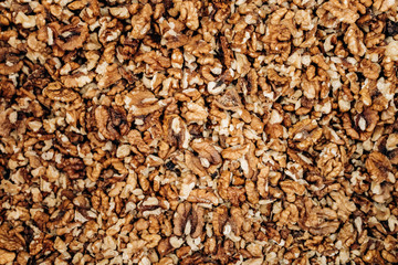 Closeup of big shelled walnuts pile. The background of their shelled walnuts.