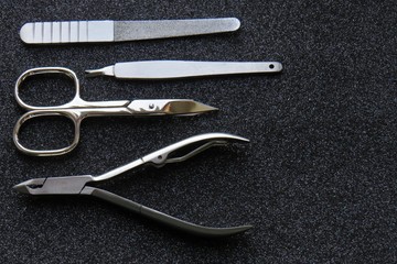 Obraz premium Minimal man's manicure sets on dark background. 