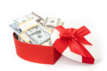 Dollars in a  gift box on a white background.  Valentine's Day. Birthday. Saving money.