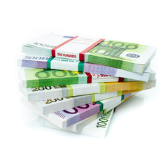 Euro banknotes stacks on a white background.