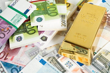Gold bars and Euro banknotes. Gold bullion and money