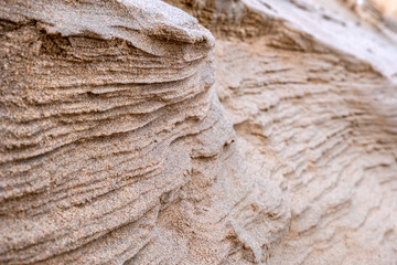 Closeup of sand with waves pattern. Beautiful natural background. Sand sea beach. Desert dunes. Abstract geometric design.