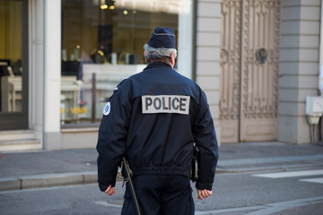 Obraz premium Portrait of national policeman standing in the street for controlling the traffic